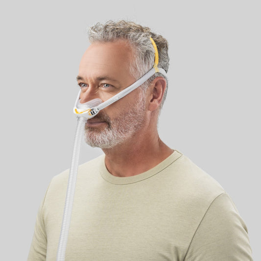 Angled View of Man Wearing Fisher & Paykel's Solo Nasal CPAP Mask W/ Headgear 