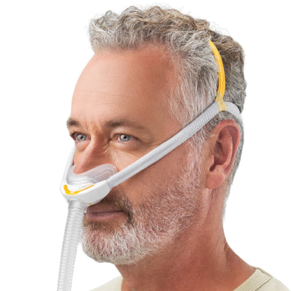 Angled View of Man Wearing Fisher & Paykel's Solo Nasal CPAP Mask W/ Headgear 